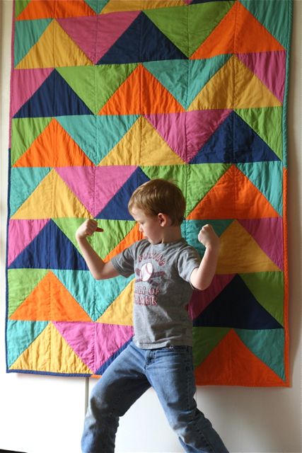 Cal in front of Triangle Quilt