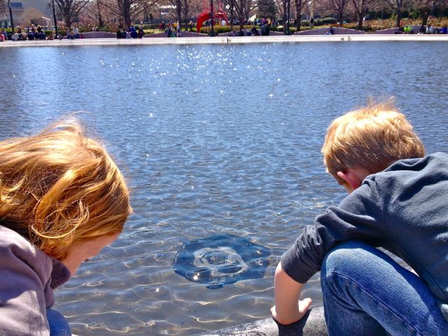 Kids in reflecting pond