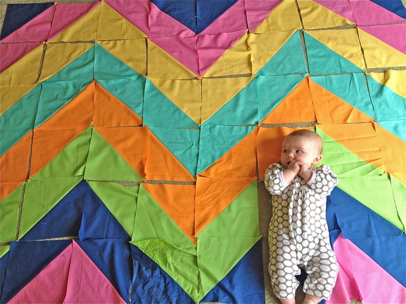 Baby on pieced quilt